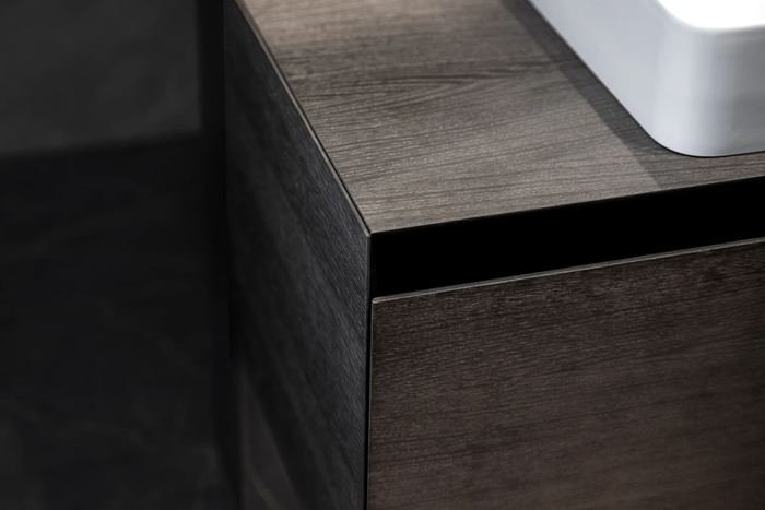 Detail of a dark oak kitchen front