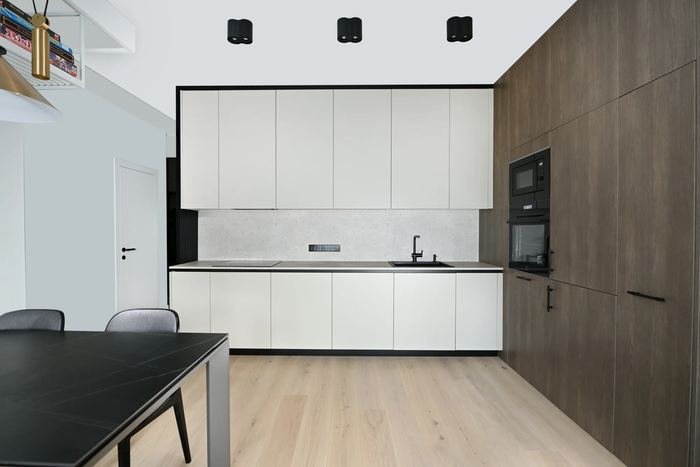 White kitchen with wood tall units