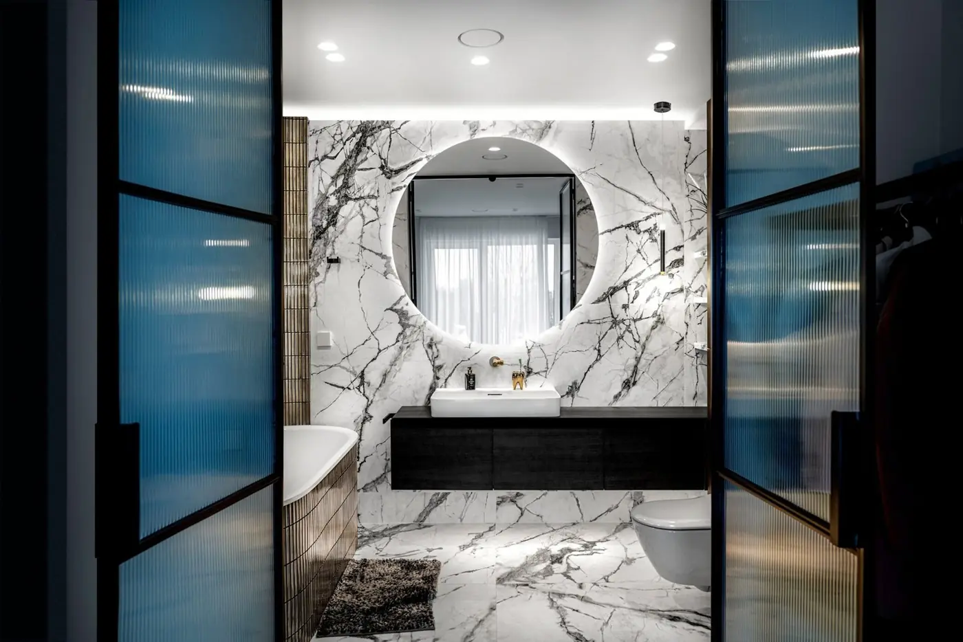 Custom bathroom vanity with marble and dark cabinetry